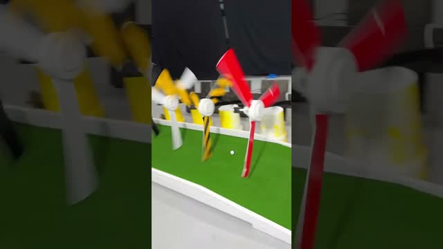 Mini Golf Through 10 Spinning Fans!!