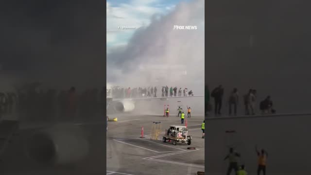 American airlines plane catches fire in Denver