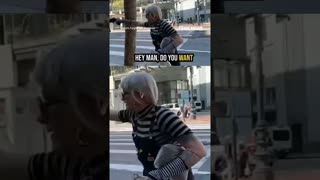 Preacher doesn't flinch as activist points apparent gun at his head