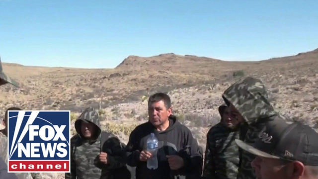 Lawrence Jones speaks with migrants at southern border