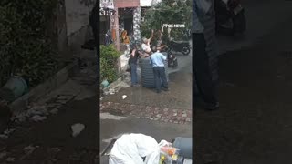 Woman miraculously escapes unharmed after a fallen water tank lands perfectly around her