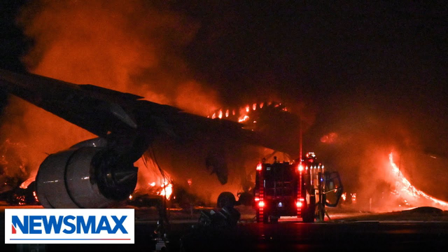 Plane bursts into flames after collision at Japan airport