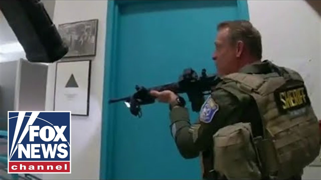 Video shows California police racing into building to confront mass shooter