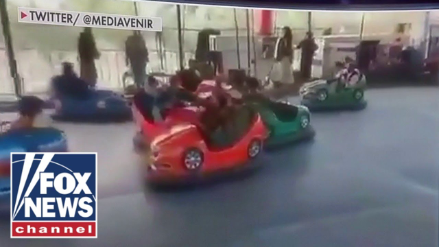 Video appears to show Taliban driving bumper cars holding grenade launchers
